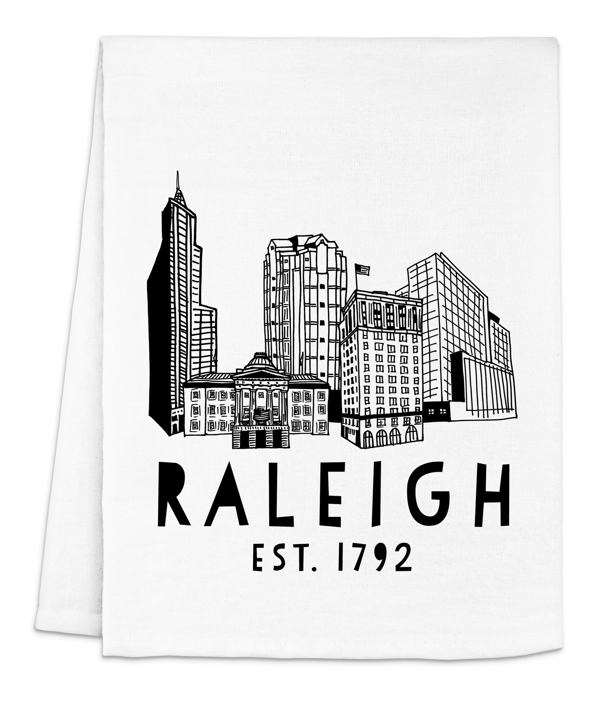 a white napkin with a black and white image of a city