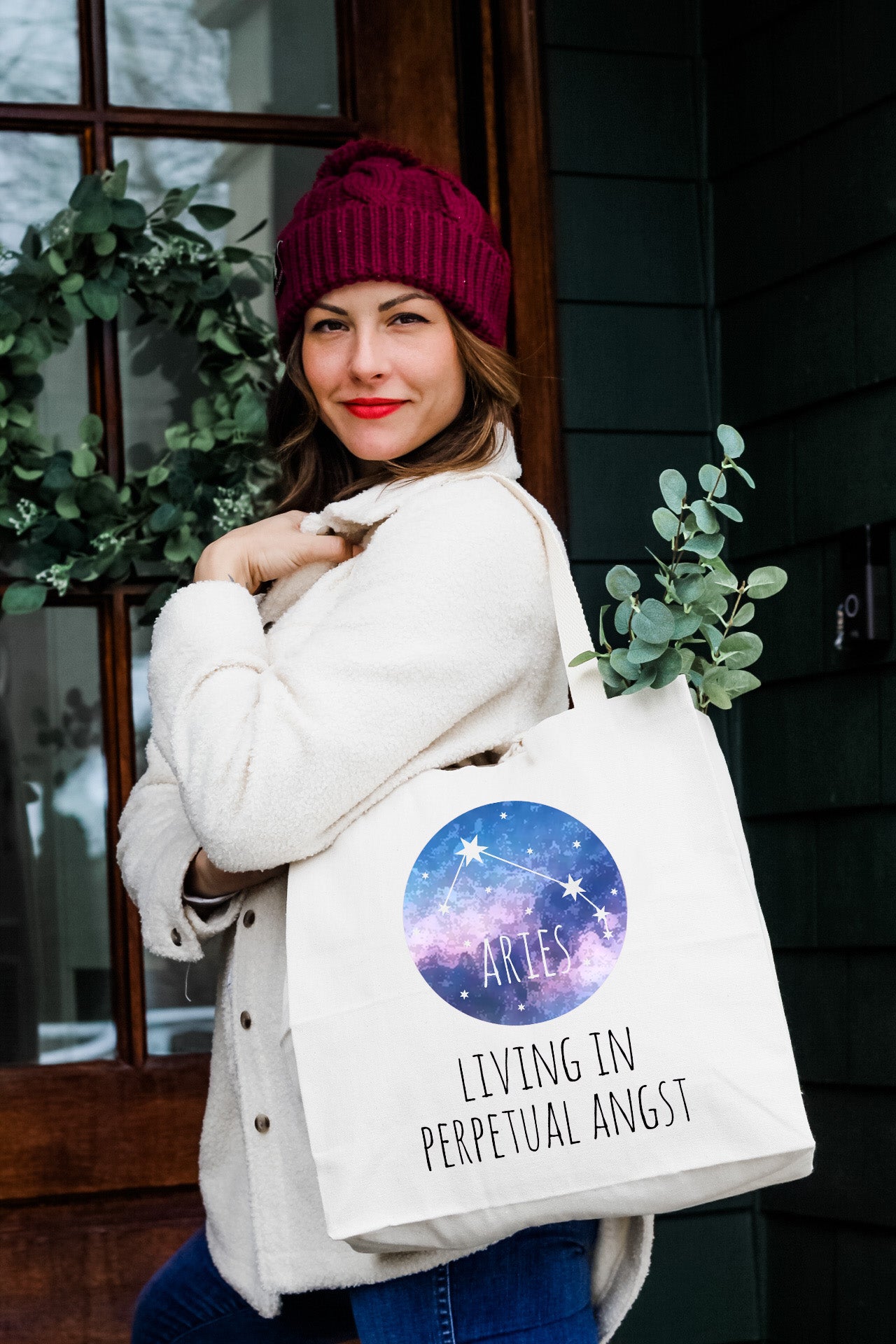 a woman carrying a white shopping bag with the words living in preperation against the