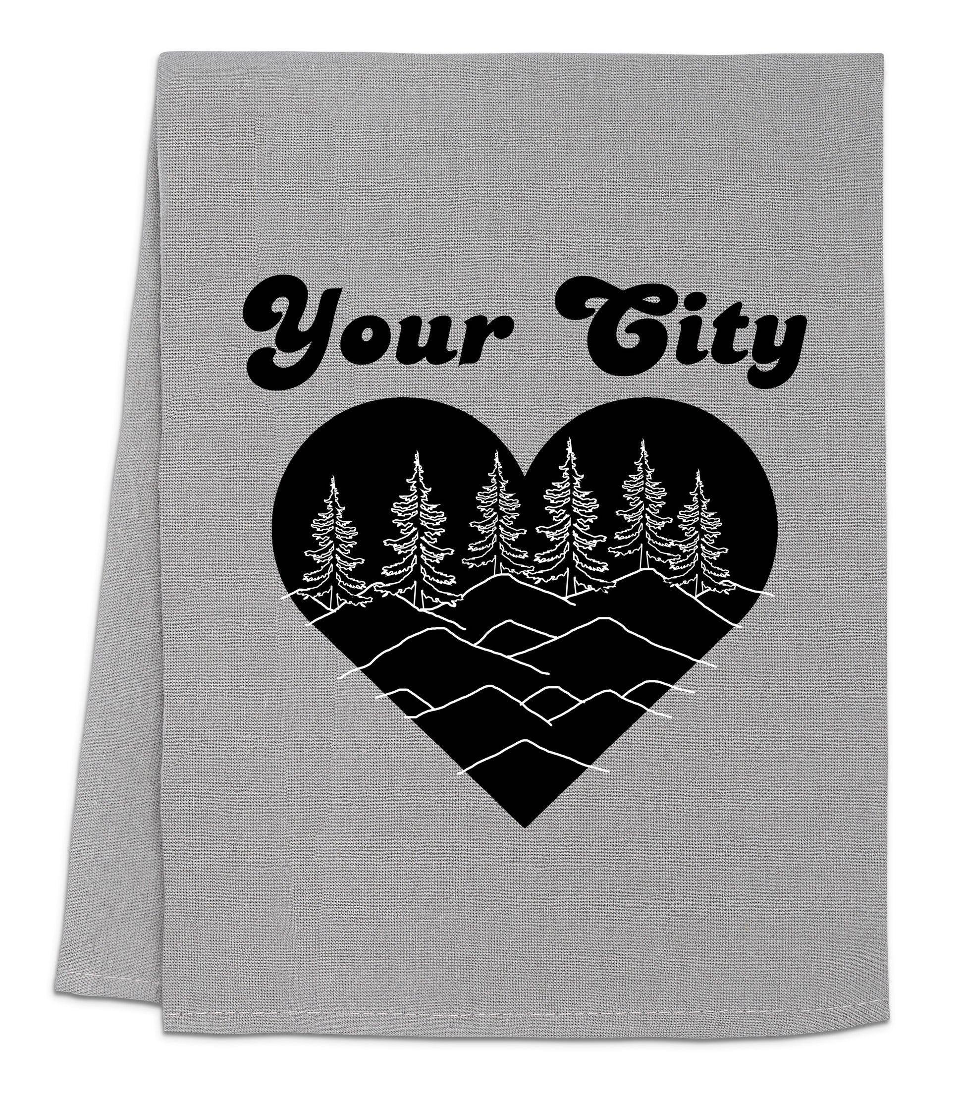 a gray towel with a black heart and trees on it