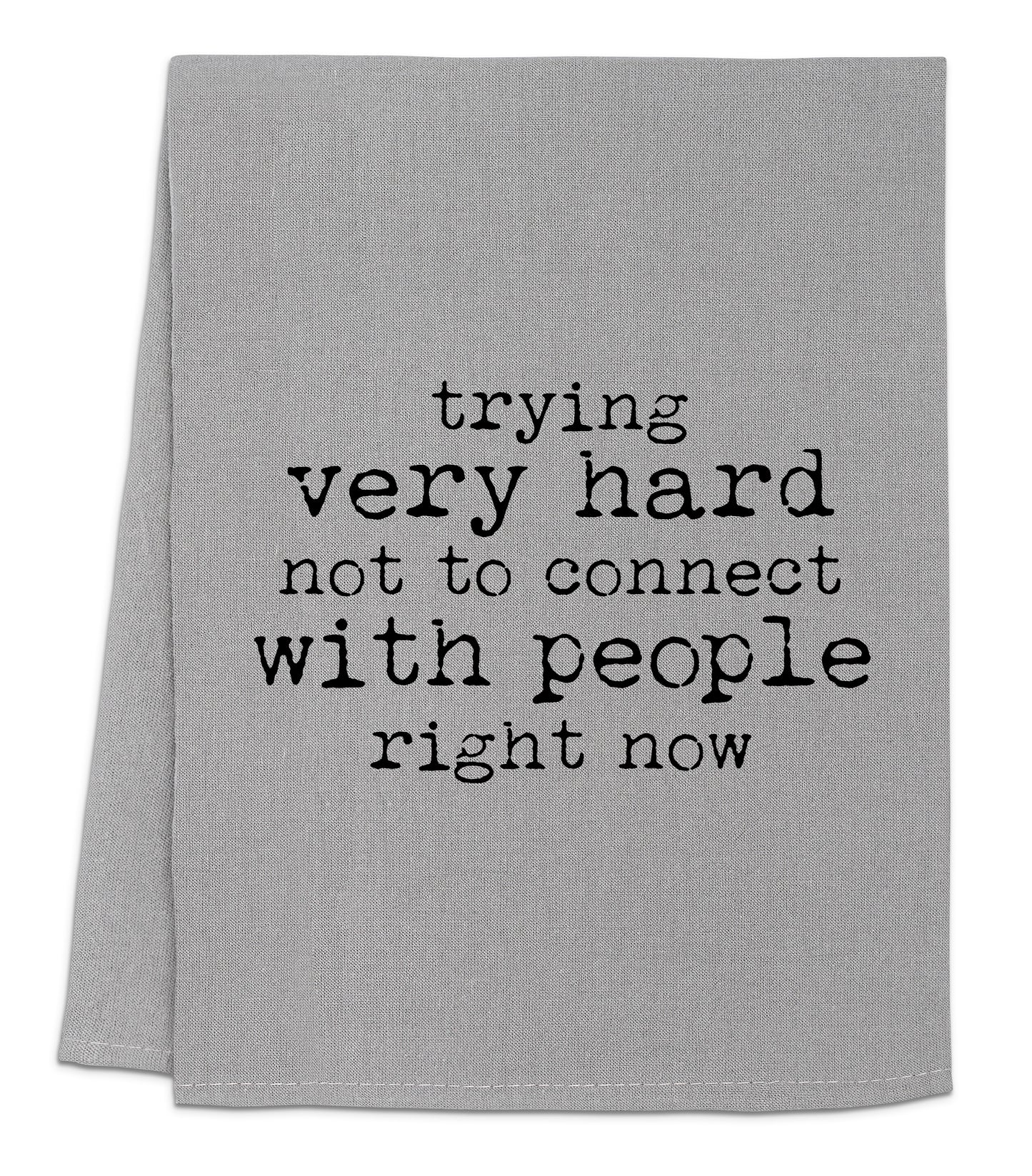 a towel with a quote on it that says trying very hard not to connect with