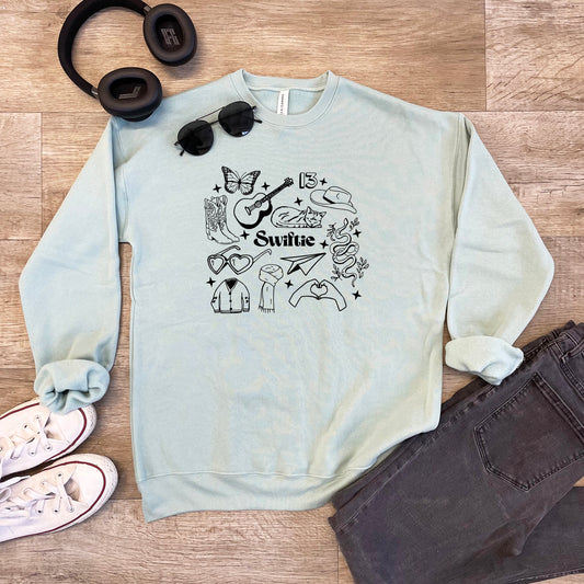 a sweater, headphones, sunglasses, and a pair of headphones
