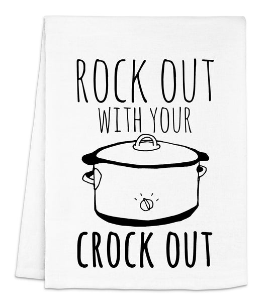 a white dish towel with a black text reading rock out with your crock out