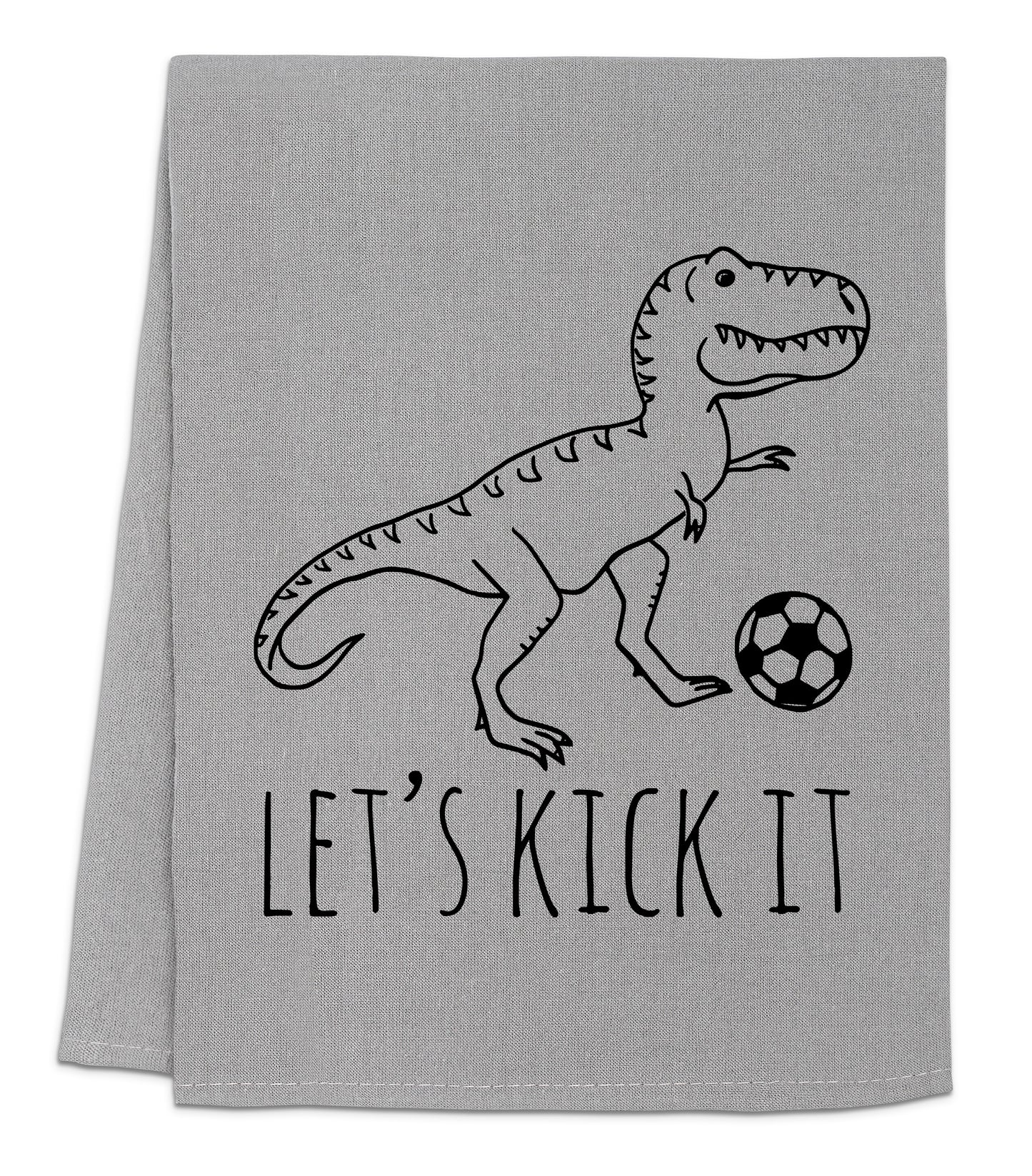 a towel with a dinosaur on it that says let's kick it