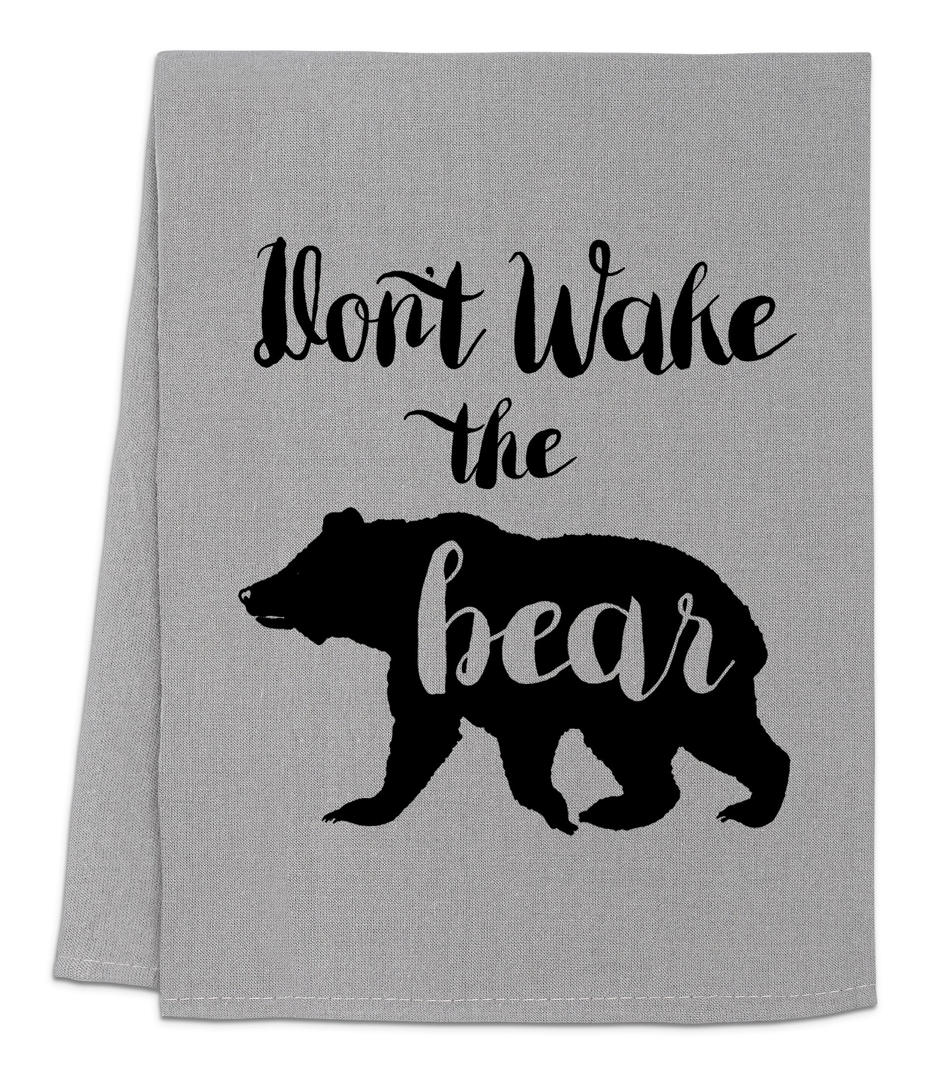 a gray tea towel with a black bear saying don't wake the bear