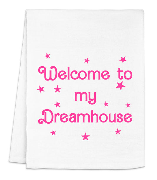 a white towel with pink lettering that says welcome to my dreamhouse