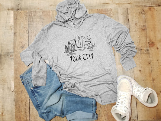 a gray hoodie with the words your city printed on it