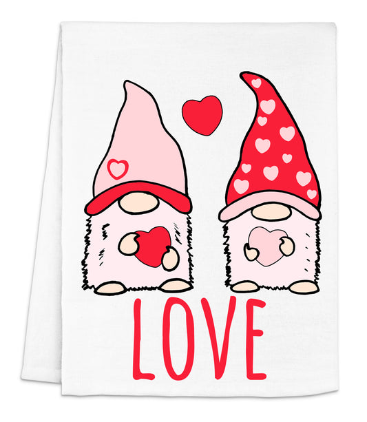 a towel with two gnomes with hearts on them