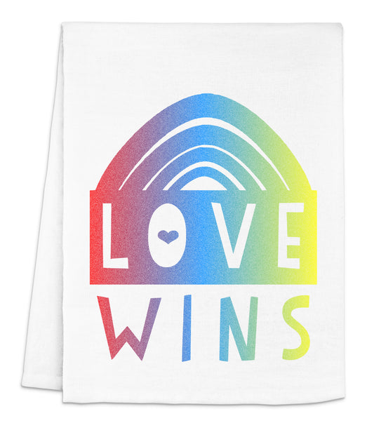 a white towel with the words love wins on it