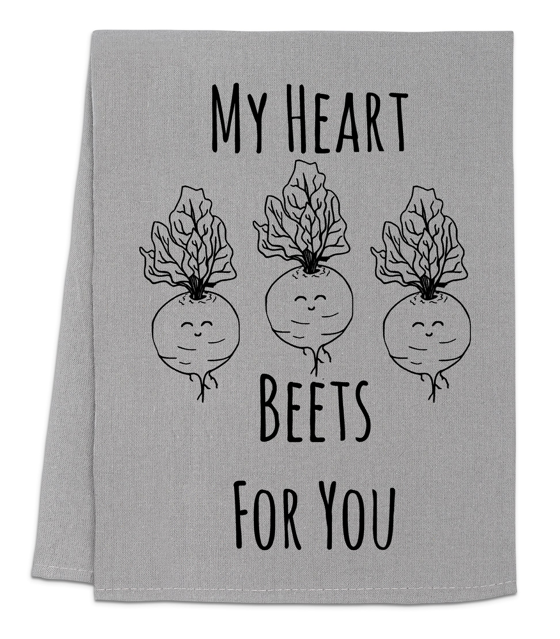 a towel with three radishes on it that says, my heart bees for