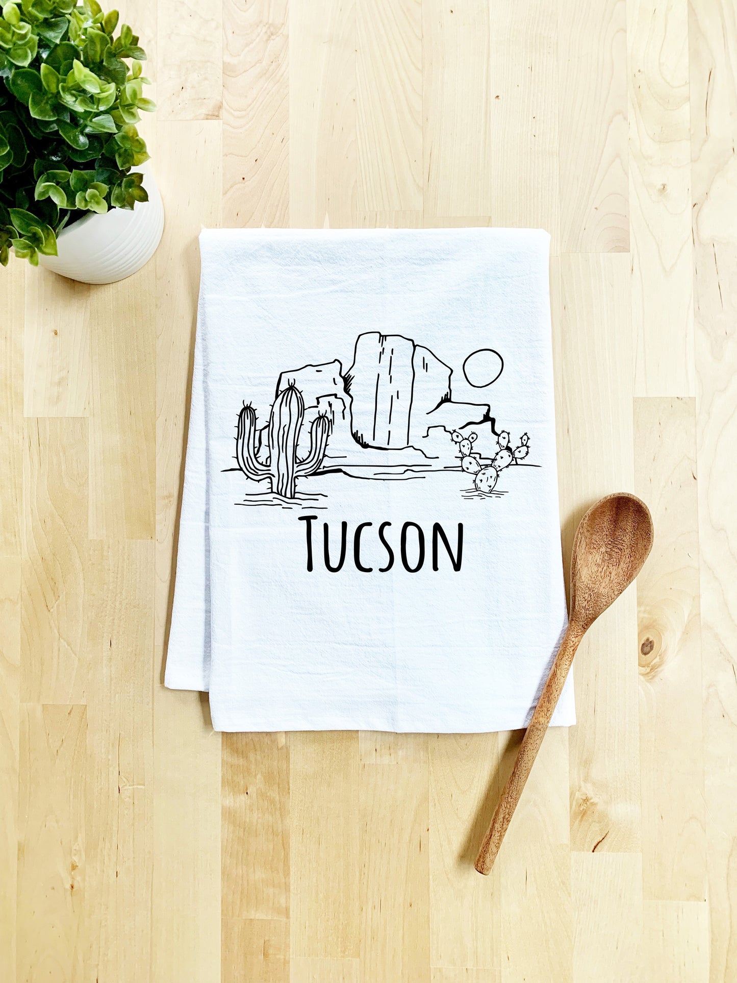 a tea towel with a picture of a cactus on it