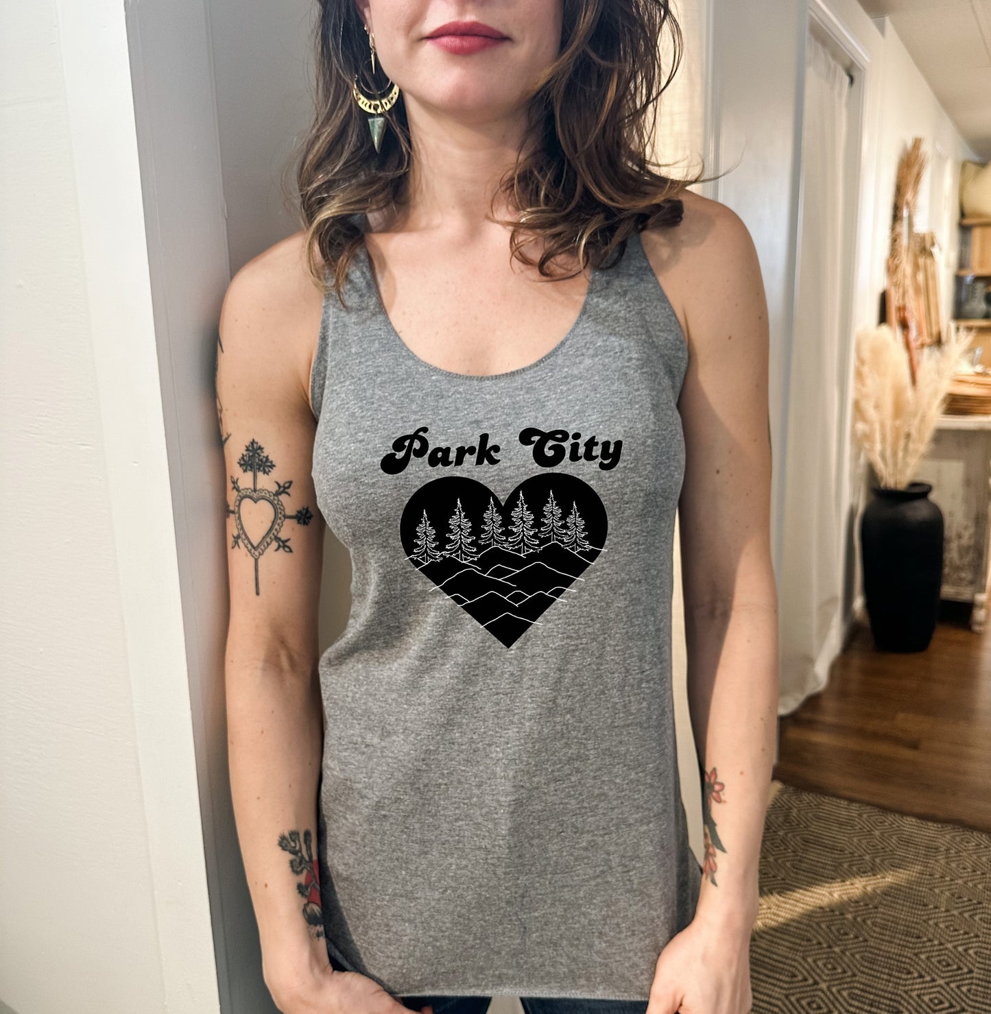 a woman wearing a tank top that says park city