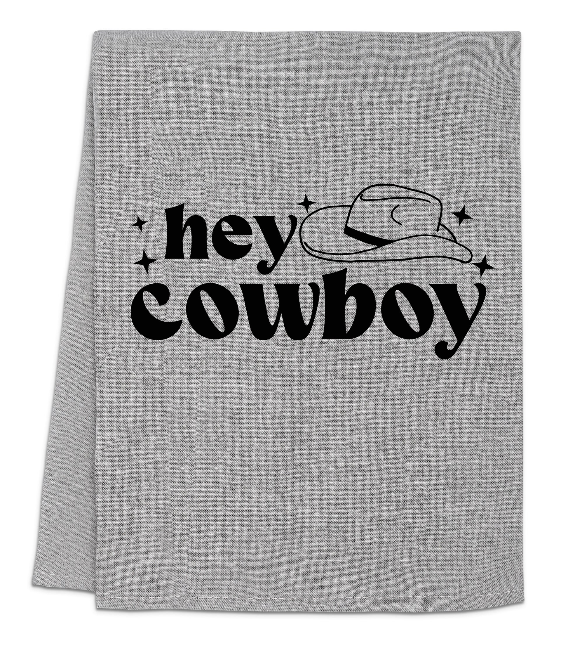 a gray towel with the words hey cowboy printed on it