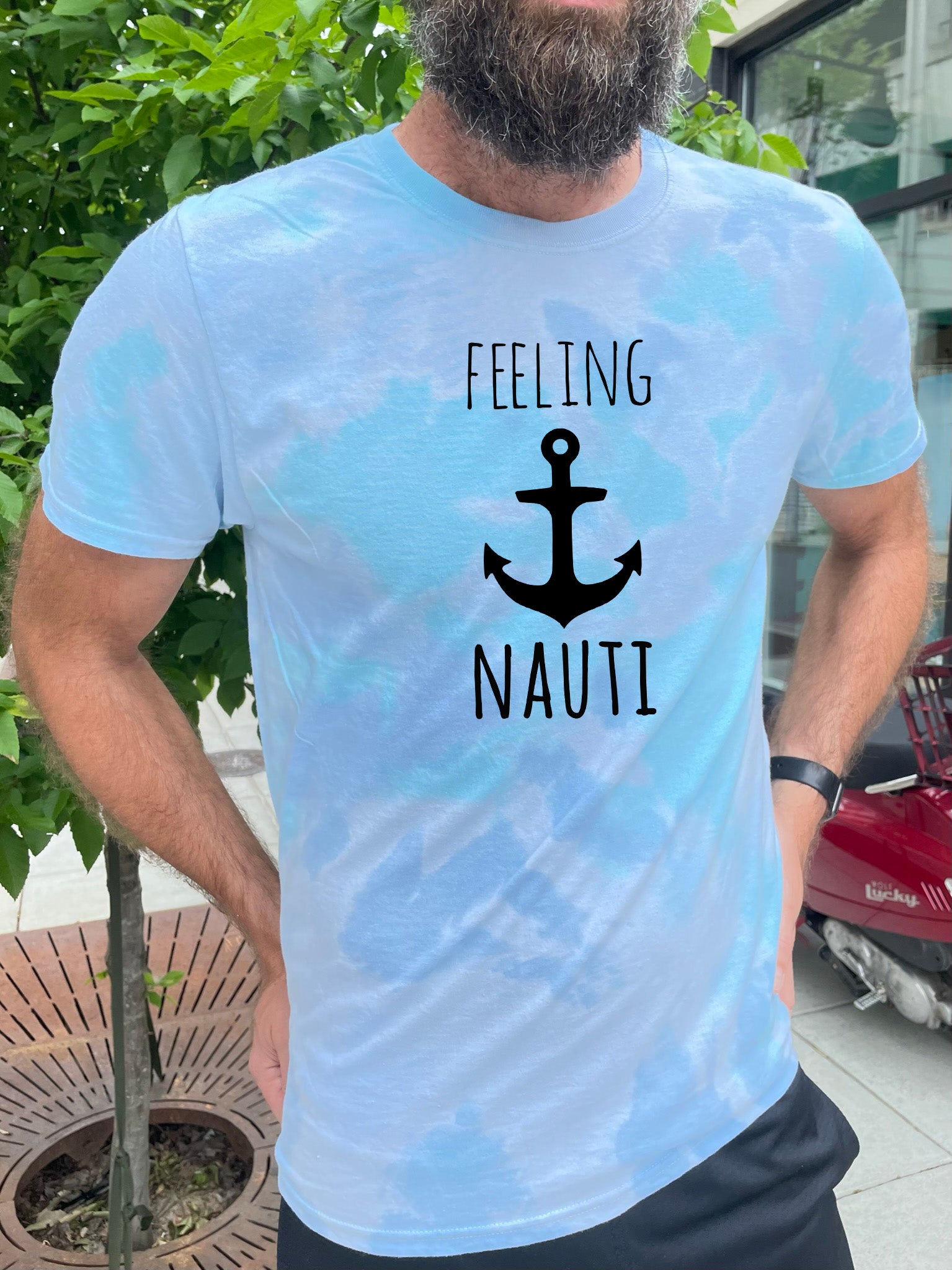 a man with a beard wearing a t - shirt that says feeling nauti