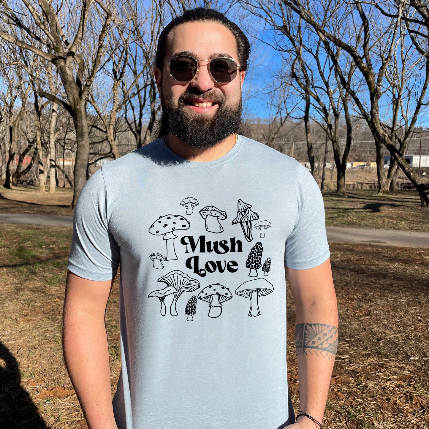 a man with a beard wearing a t - shirt that says mushroom love