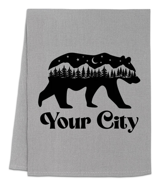 a towel with a bear and trees on it