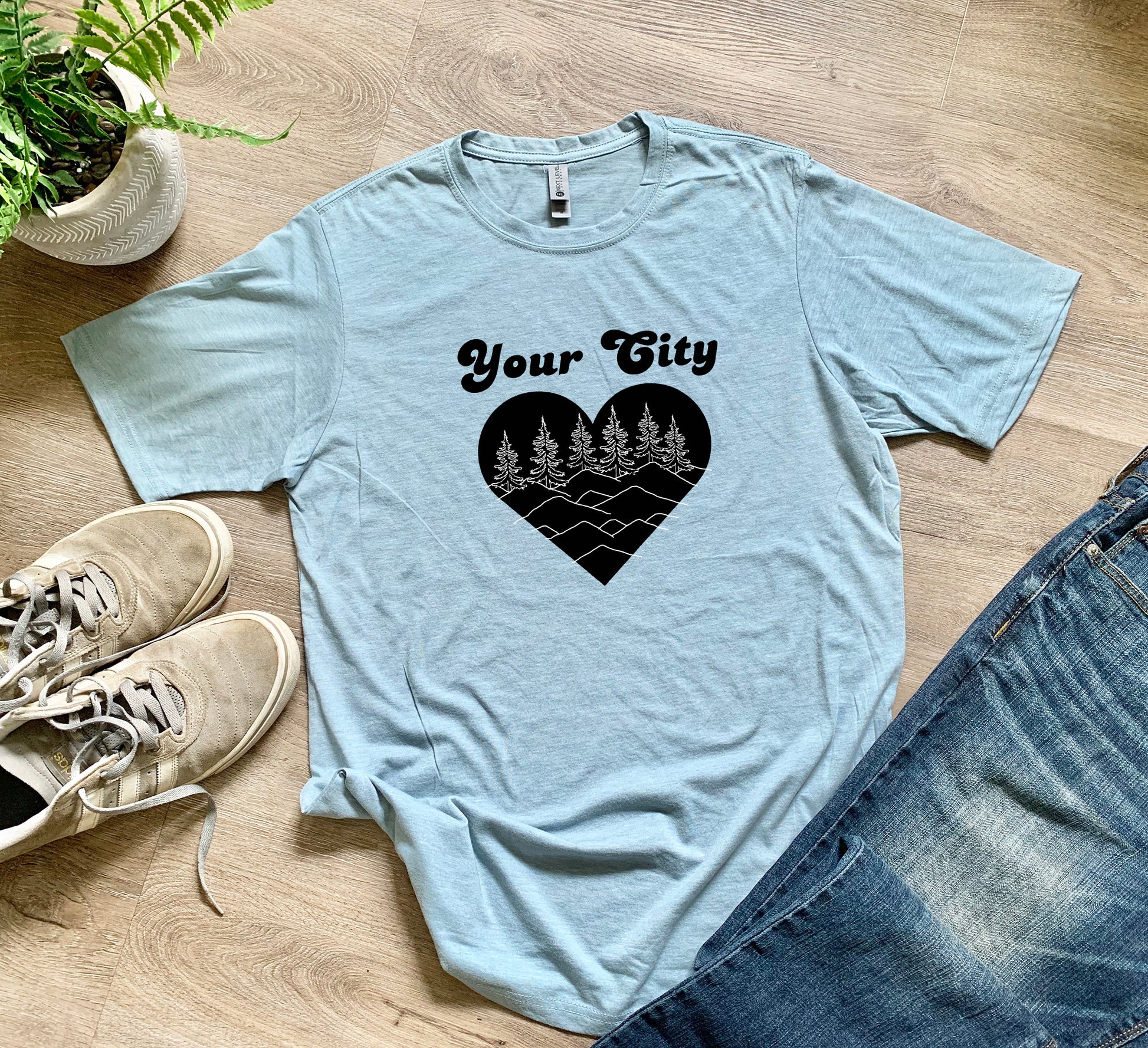 a t - shirt that says your city with trees in the heart