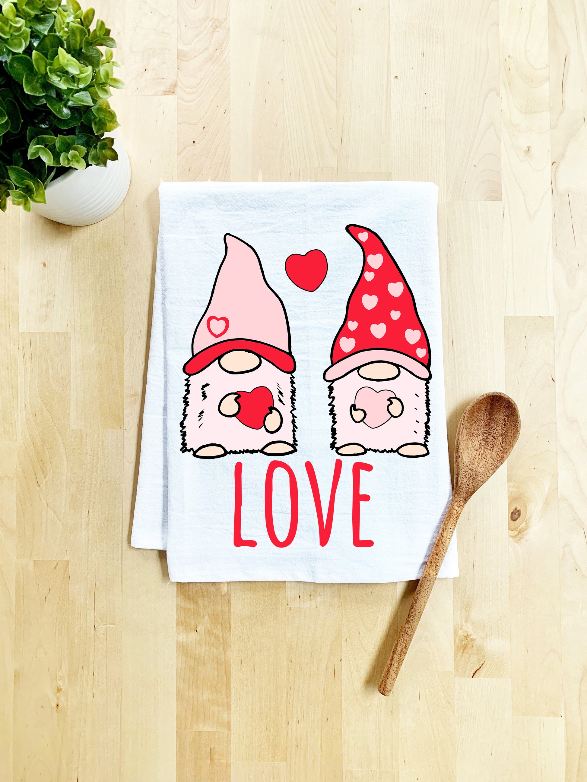 a tea towel with two gnomes on it