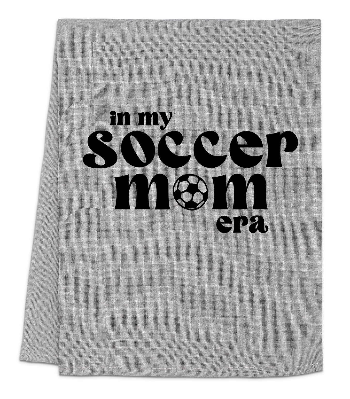 a gray towel with a soccer mom on it