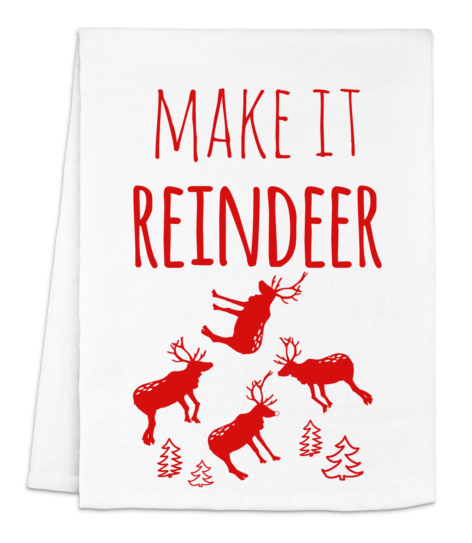a tea towel with reindeers and trees printed on it