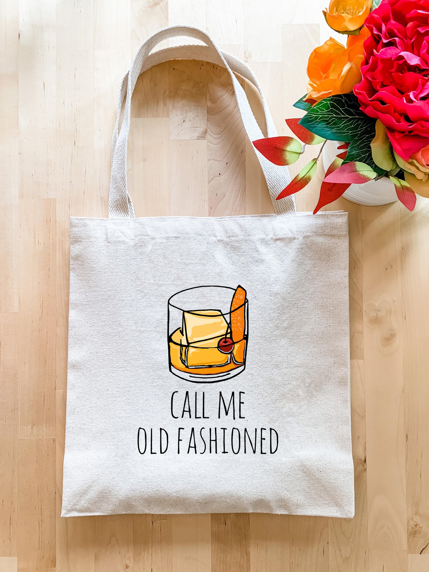 a tote bag with a picture of a glass of whiskey