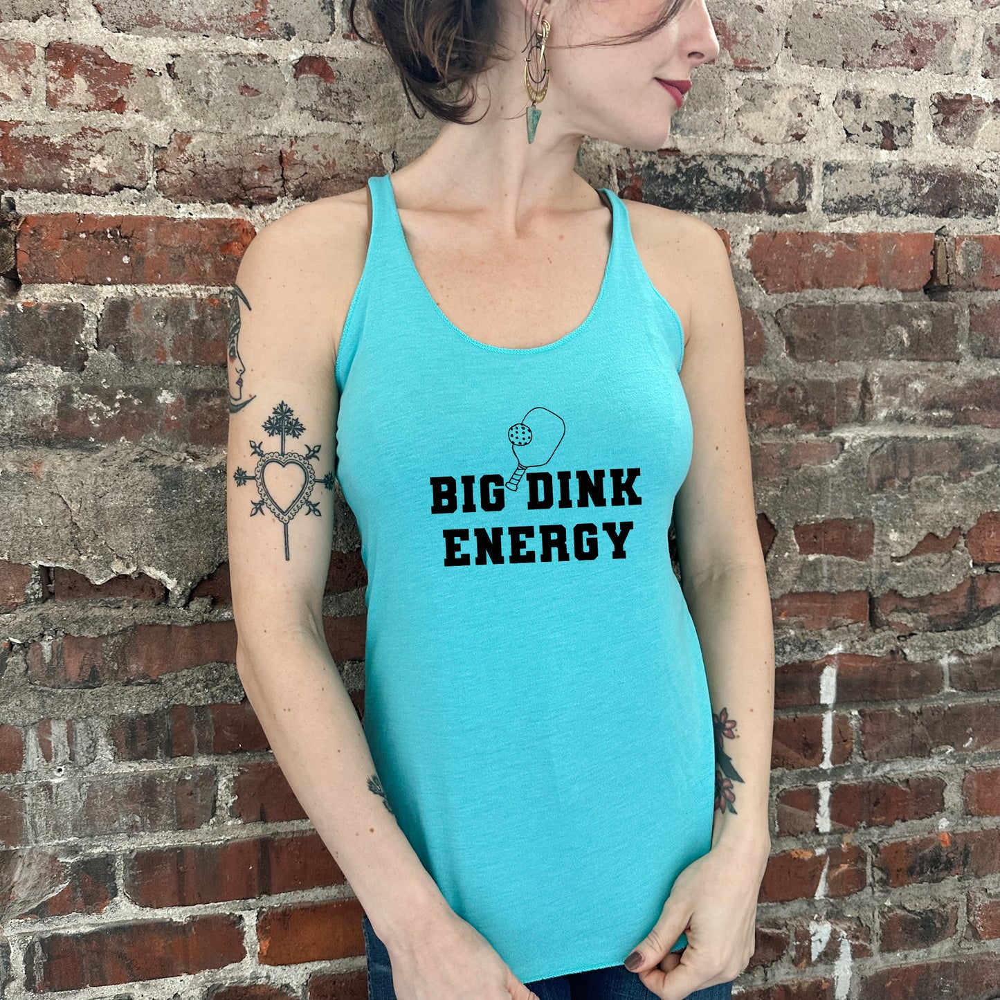 a woman wearing a tank top that says, big drink energy