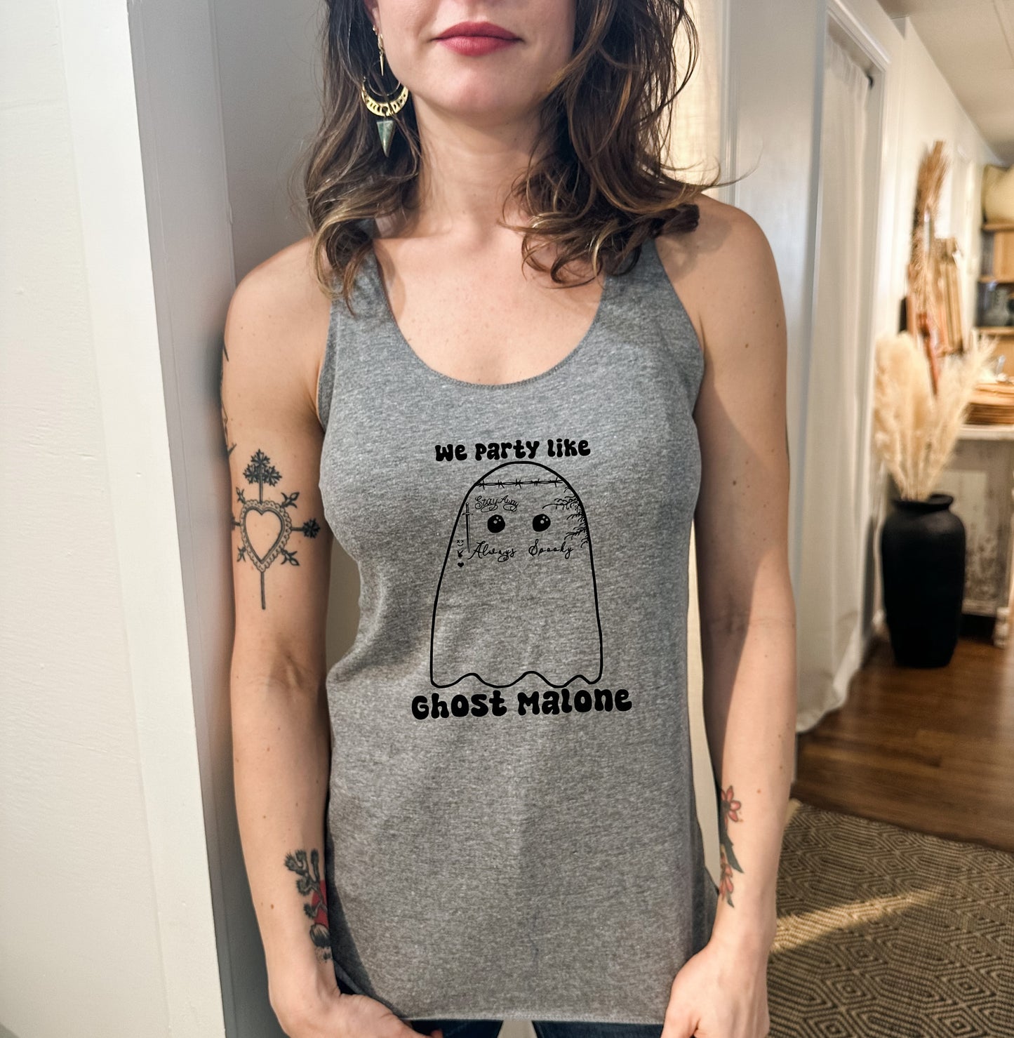 a woman wearing a grey tank top with a polar bear on it