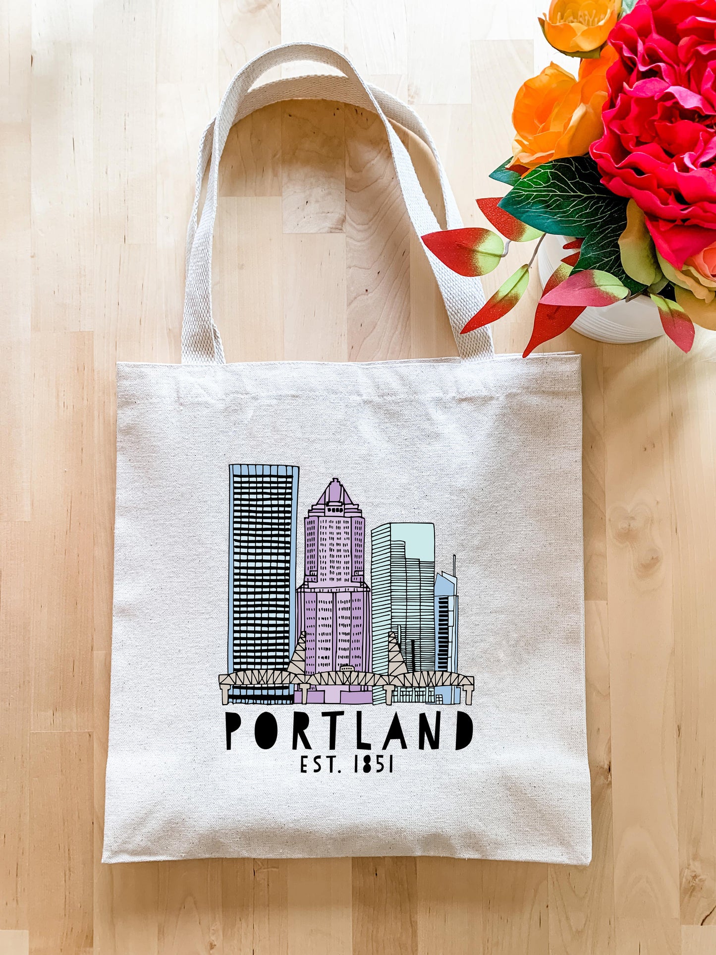 a tote bag with a picture of a city on it