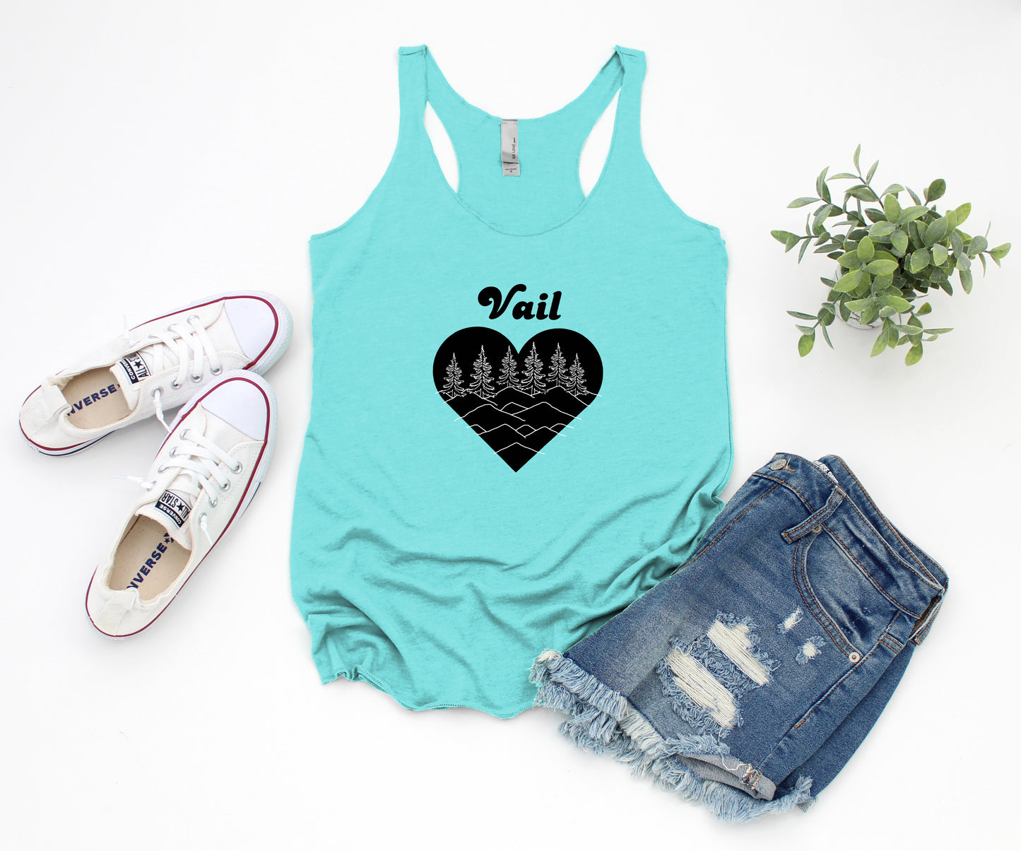 a tank top with a heart and trees on it