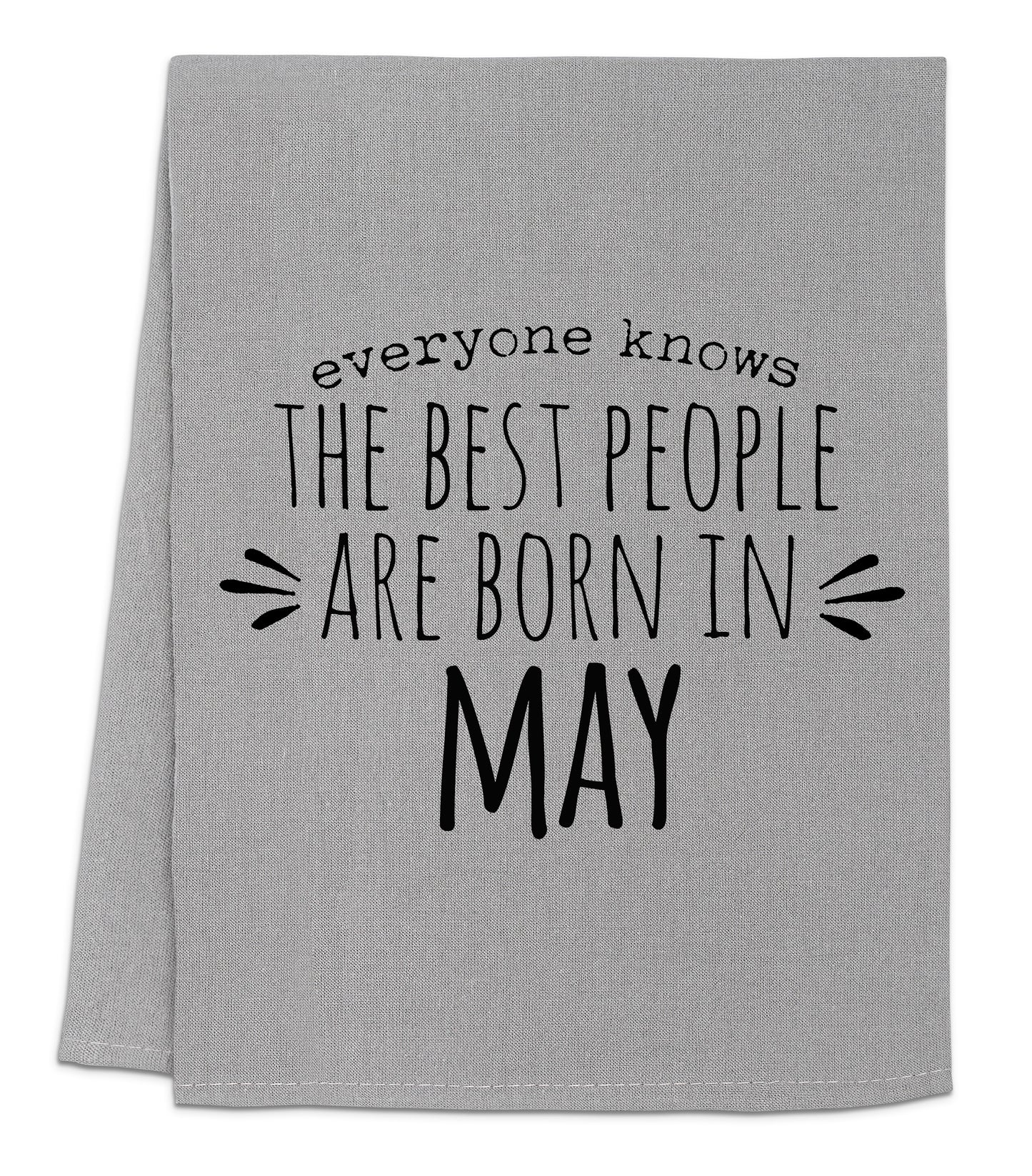 a gray towel with black lettering that says everyone knows the best people are born in