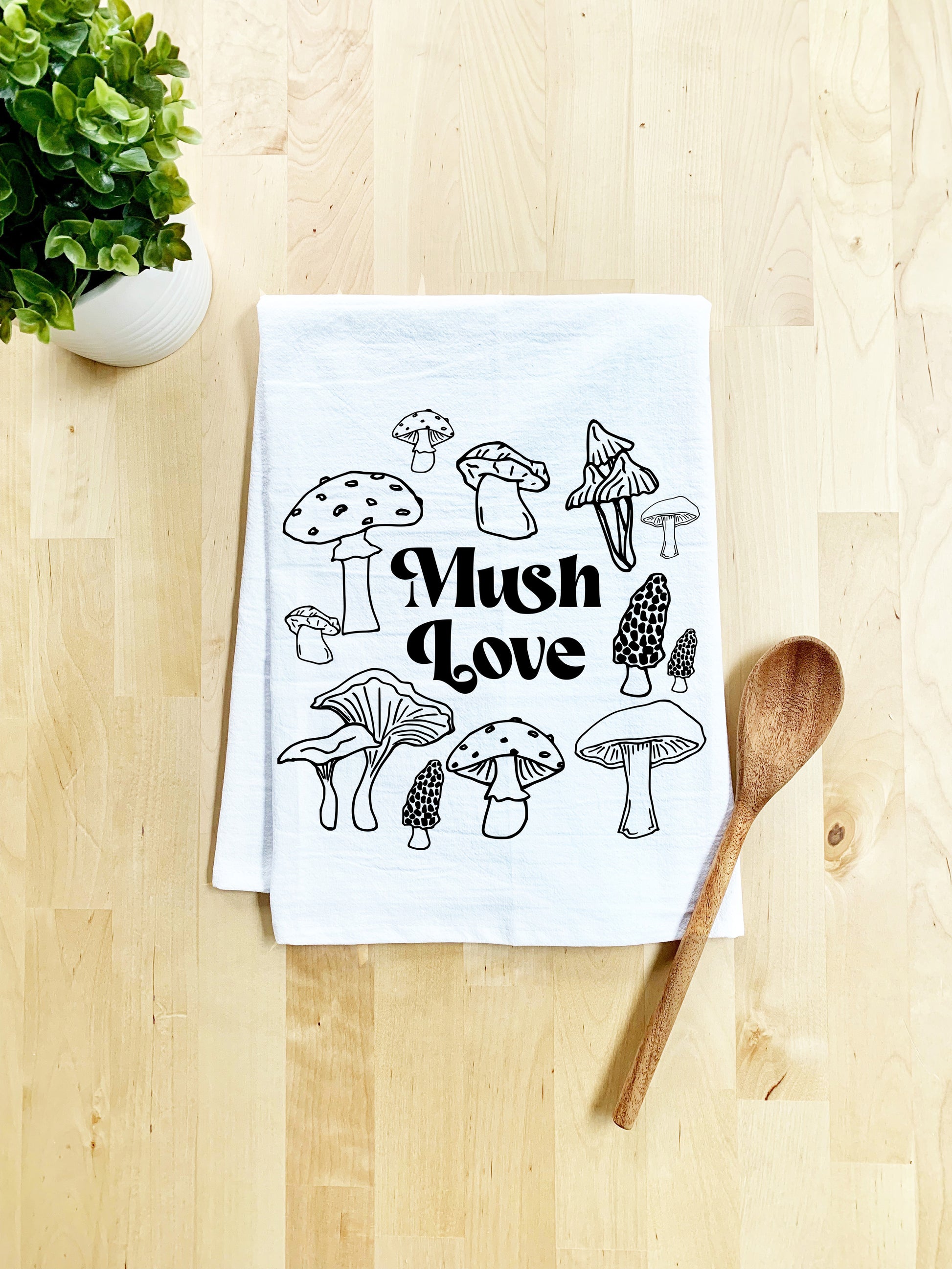 a dish towel with mushrooms printed on it