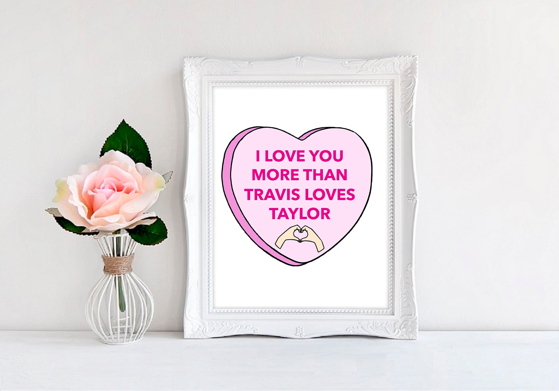 a picture of a pink heart with the words i love you more than travis loves
