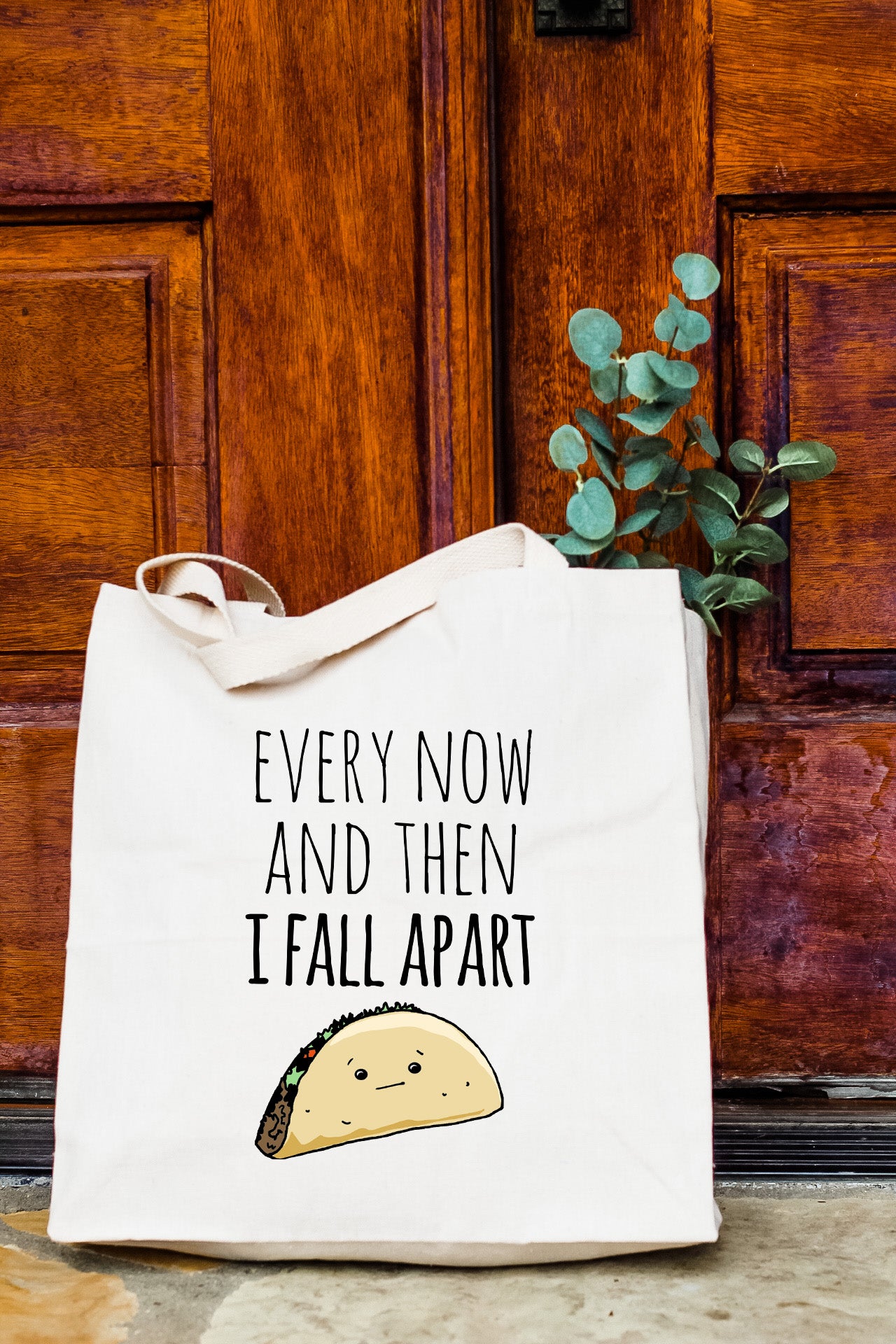 a white tote bag with a picture of a taco on it