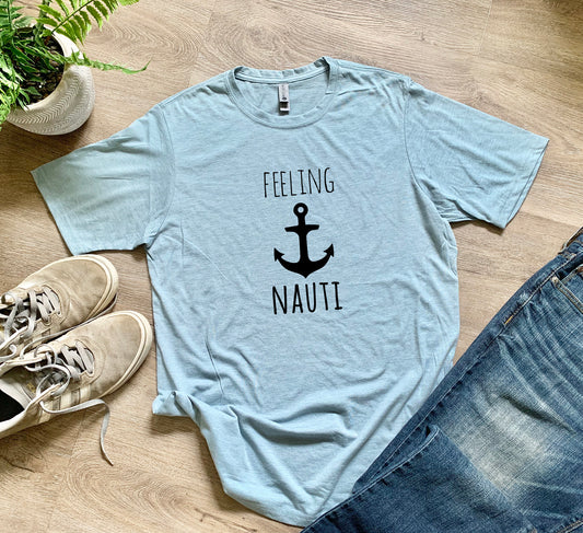 a t - shirt that says feeling nautit next to a pair of jeans