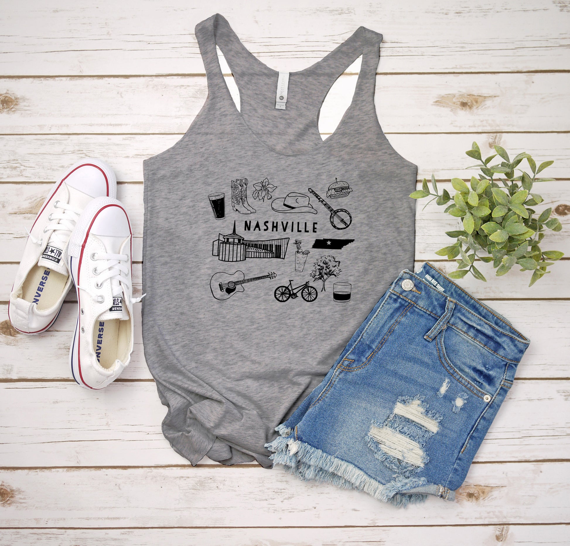 a women's tank top that says nashville on it