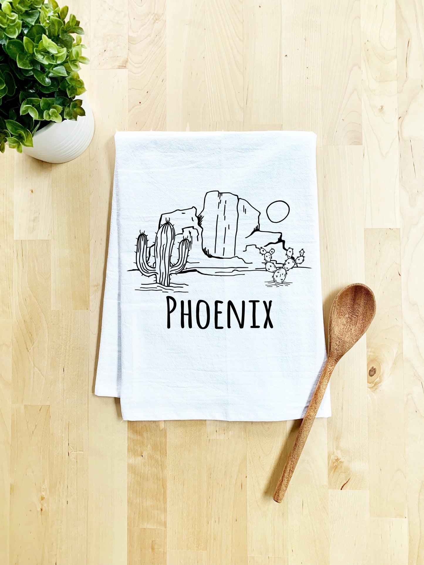 a tea towel with the words phoenix printed on it next to a