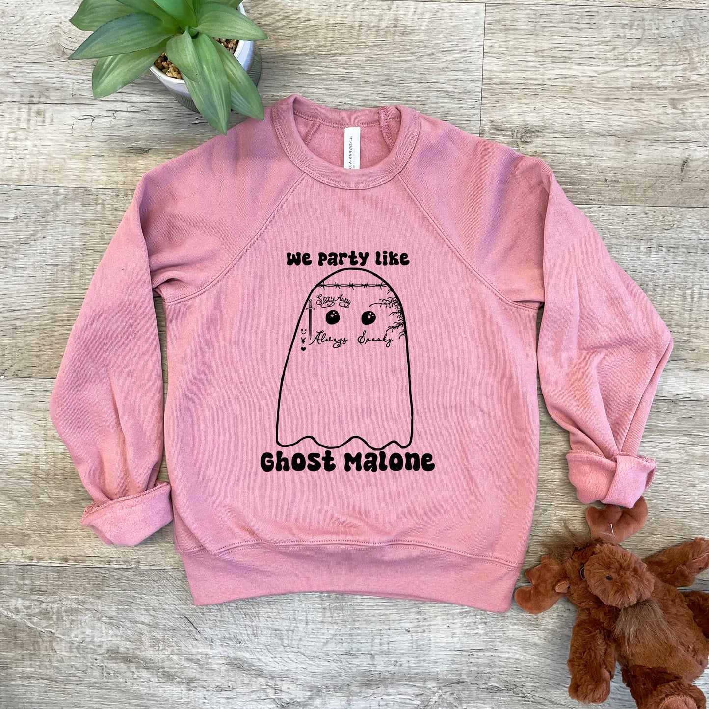 a pink sweatshirt that says we party like ghost nation