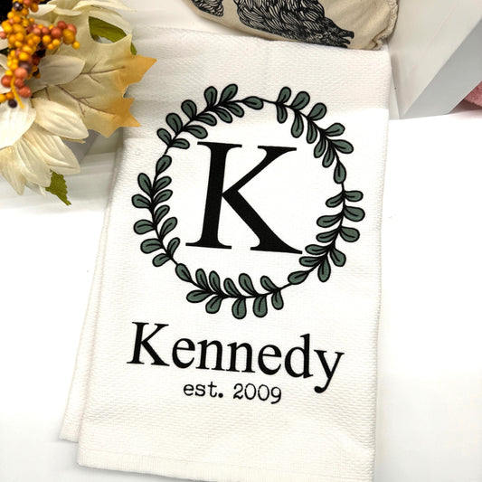 a white towel with a black and white monogrammed k on it