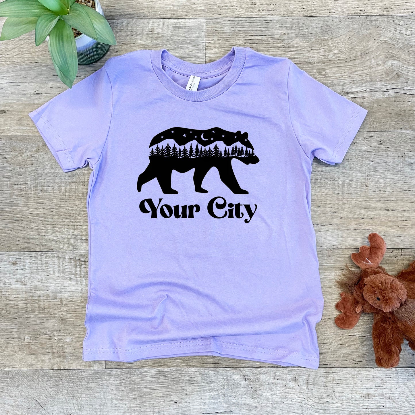a t - shirt with a bear on it that says your city
