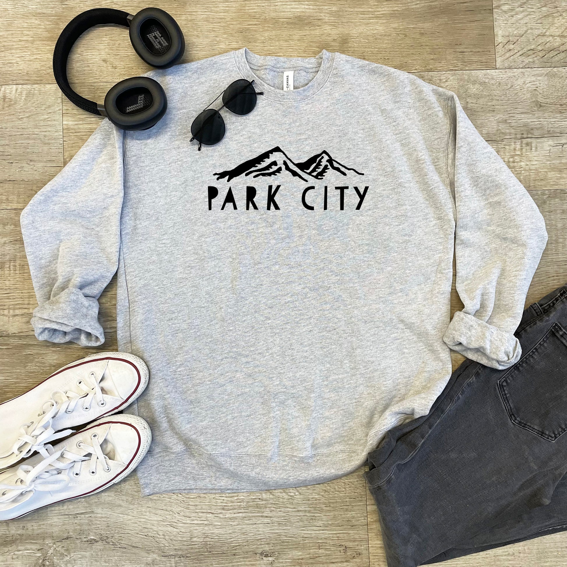 a sweatshirt that says park city with headphones on it