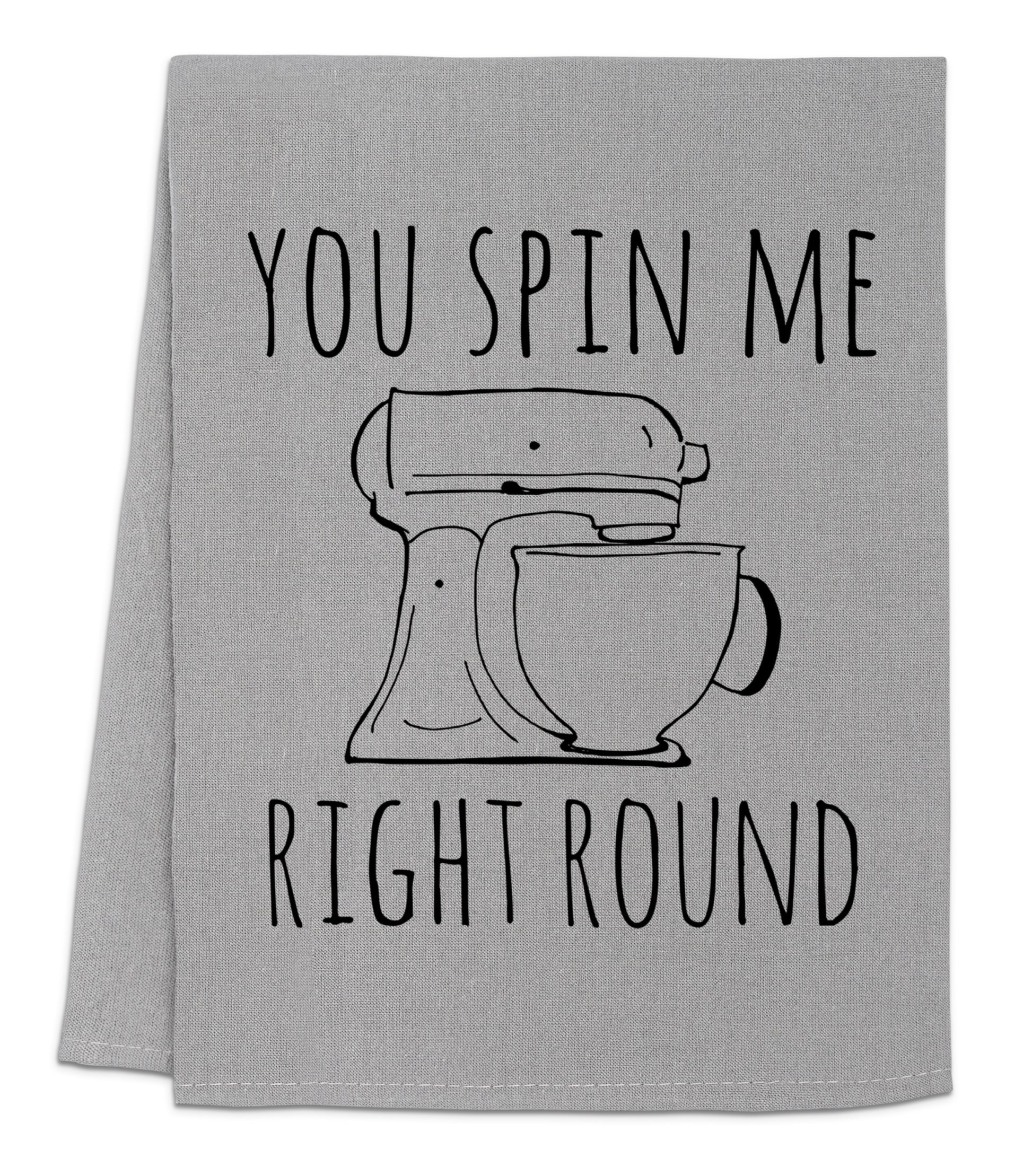 a kitchen towel with a mixer on it that says you spin me right round