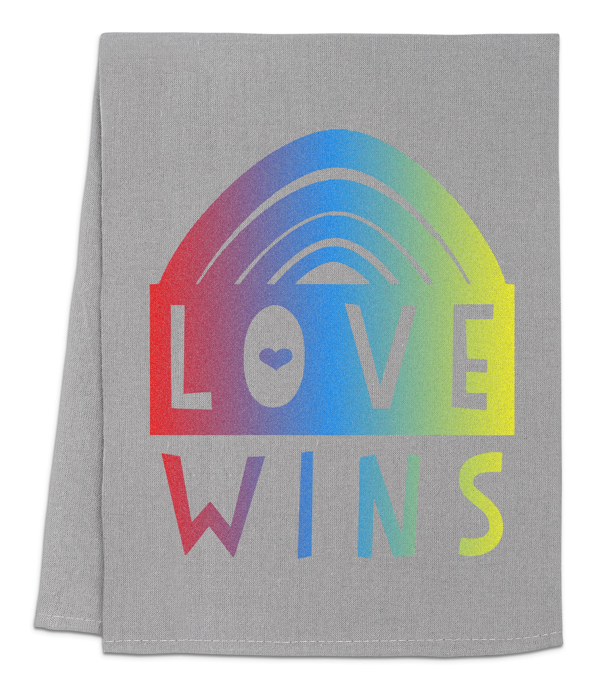 a towel with the words love wins on it