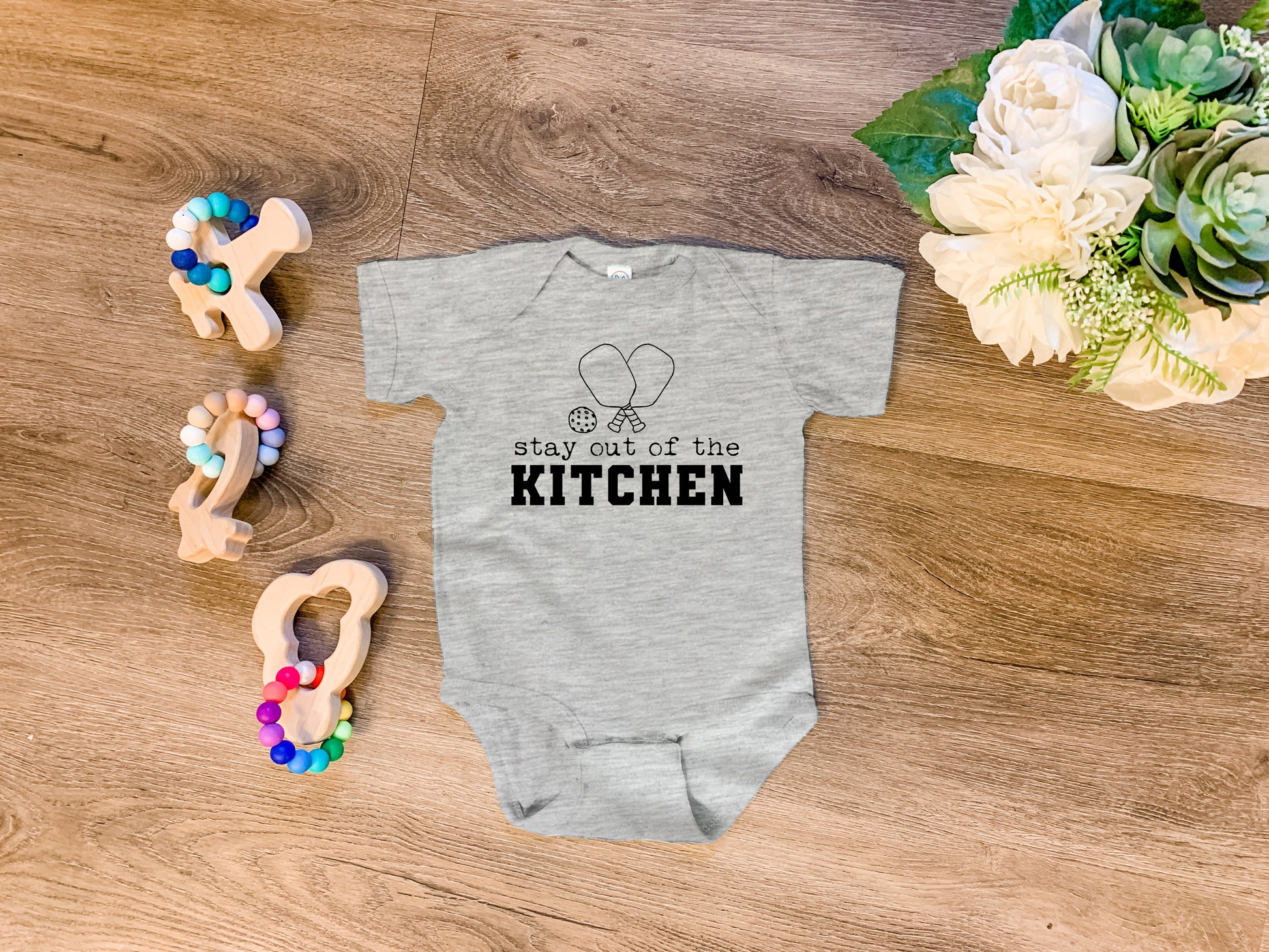 a baby bodysuit that says, may get of the kitchen