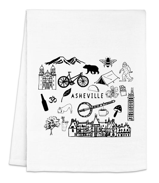a white dish towel with a black and white illustration of a city