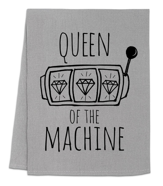 a tea towel with the words queen of the machine on it