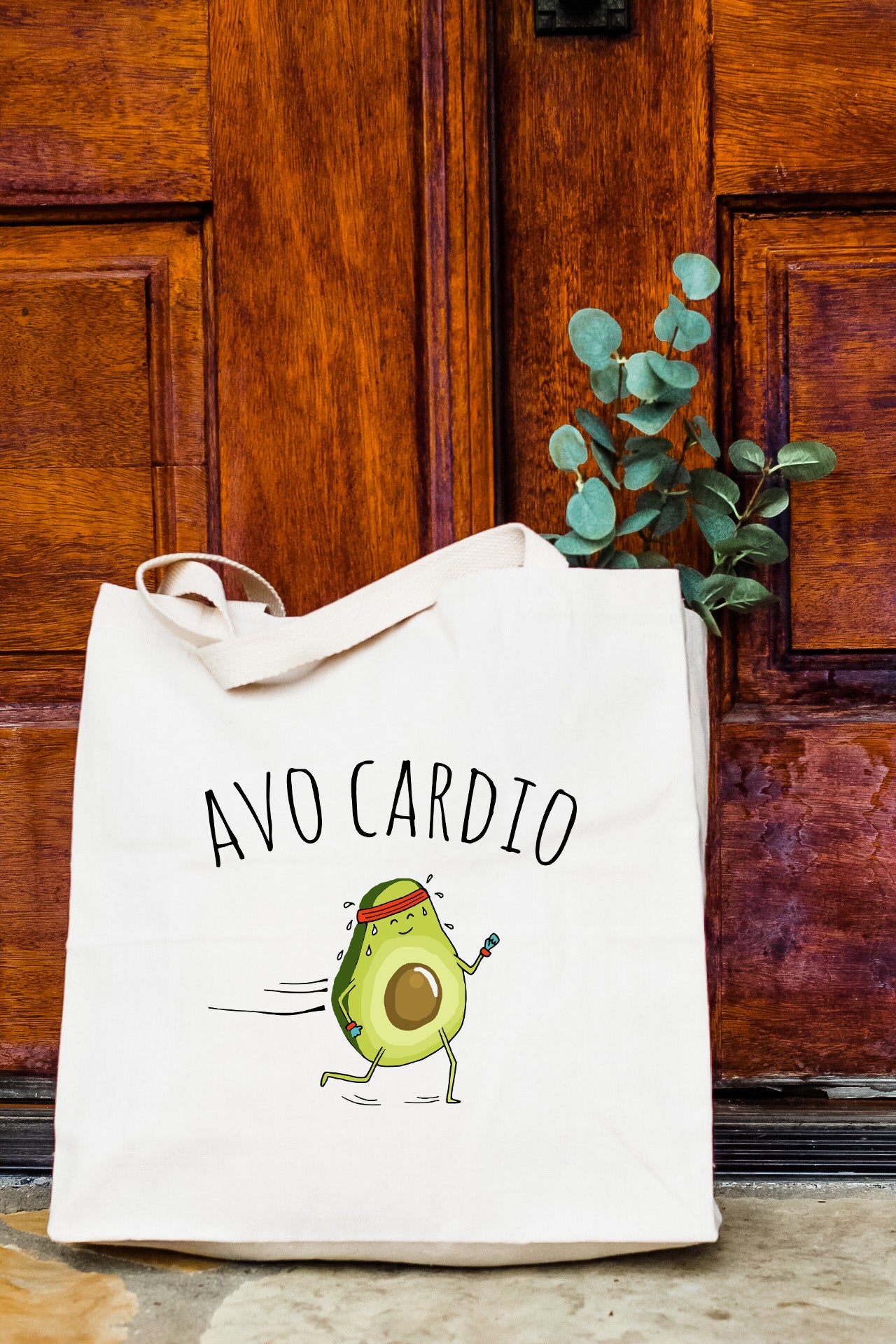 a white bag with a cartoon avocado on it