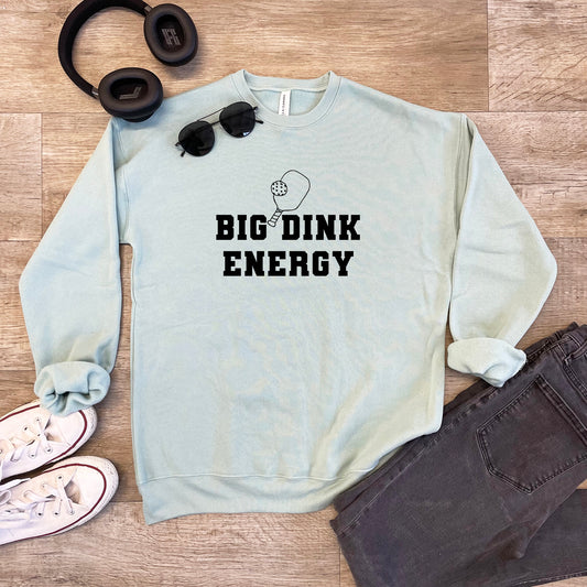 a sweatshirt that says,'big drink energy'and a pair of headphones