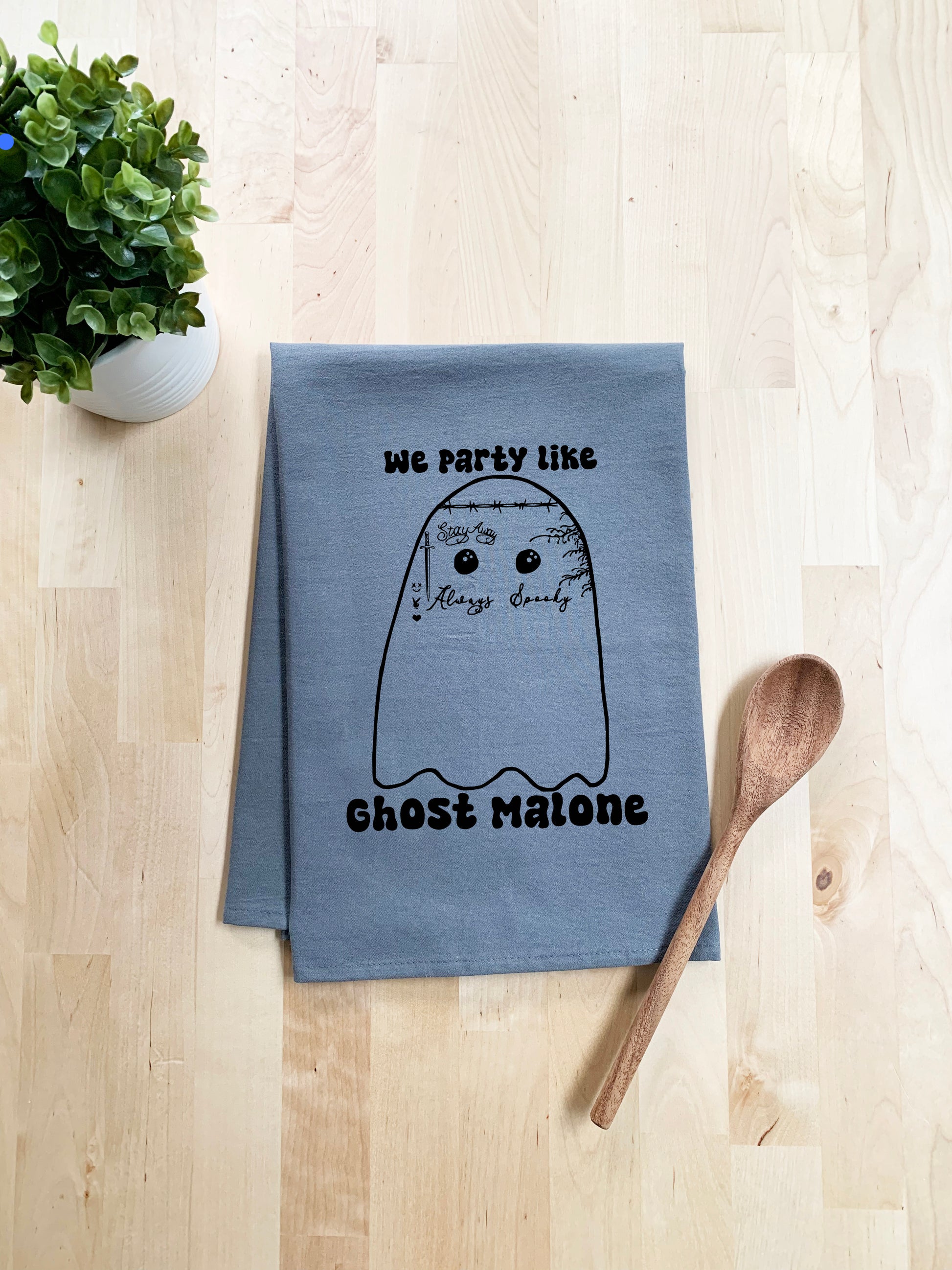 a tea towel with a picture of a ghost on it