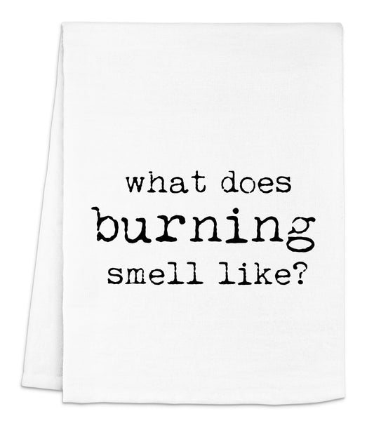 a white dish towel that says what does burning smell like?