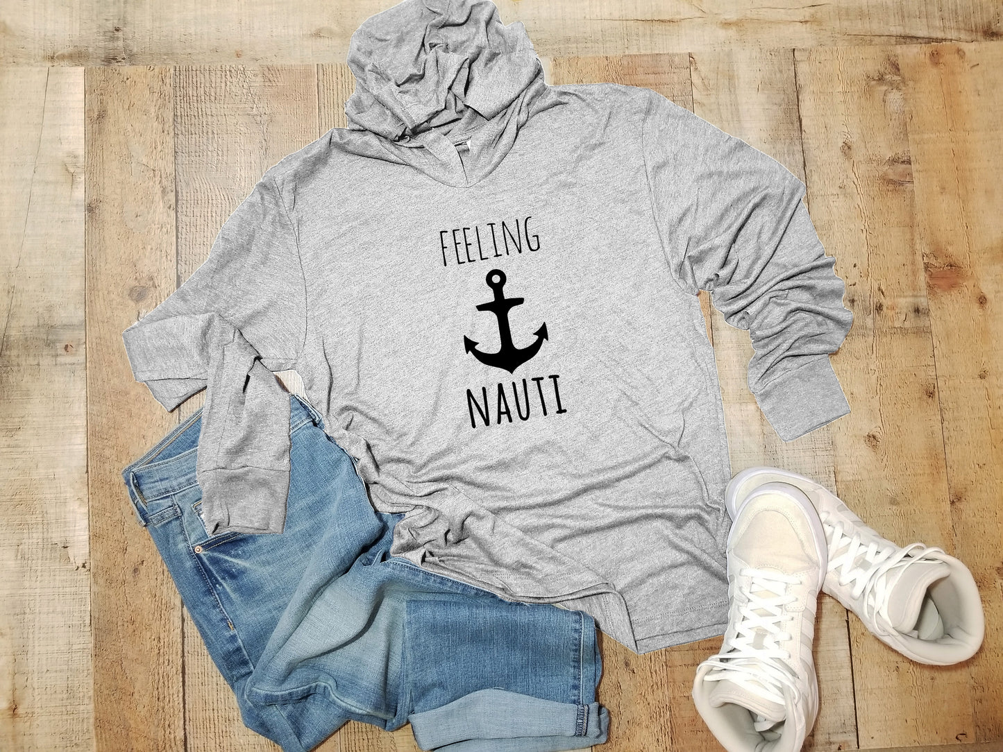 a gray hoodie with the words feeling nauti on it