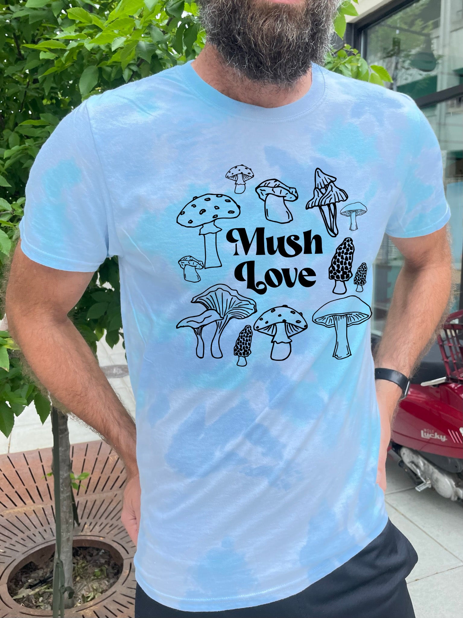 a man with a beard wearing a t - shirt that says mush love